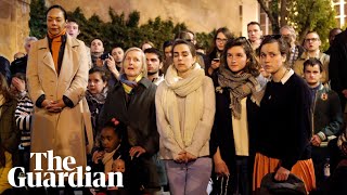 Parisians gather outside burning Notre Dame to sing hymns [upl. by Coreen537]